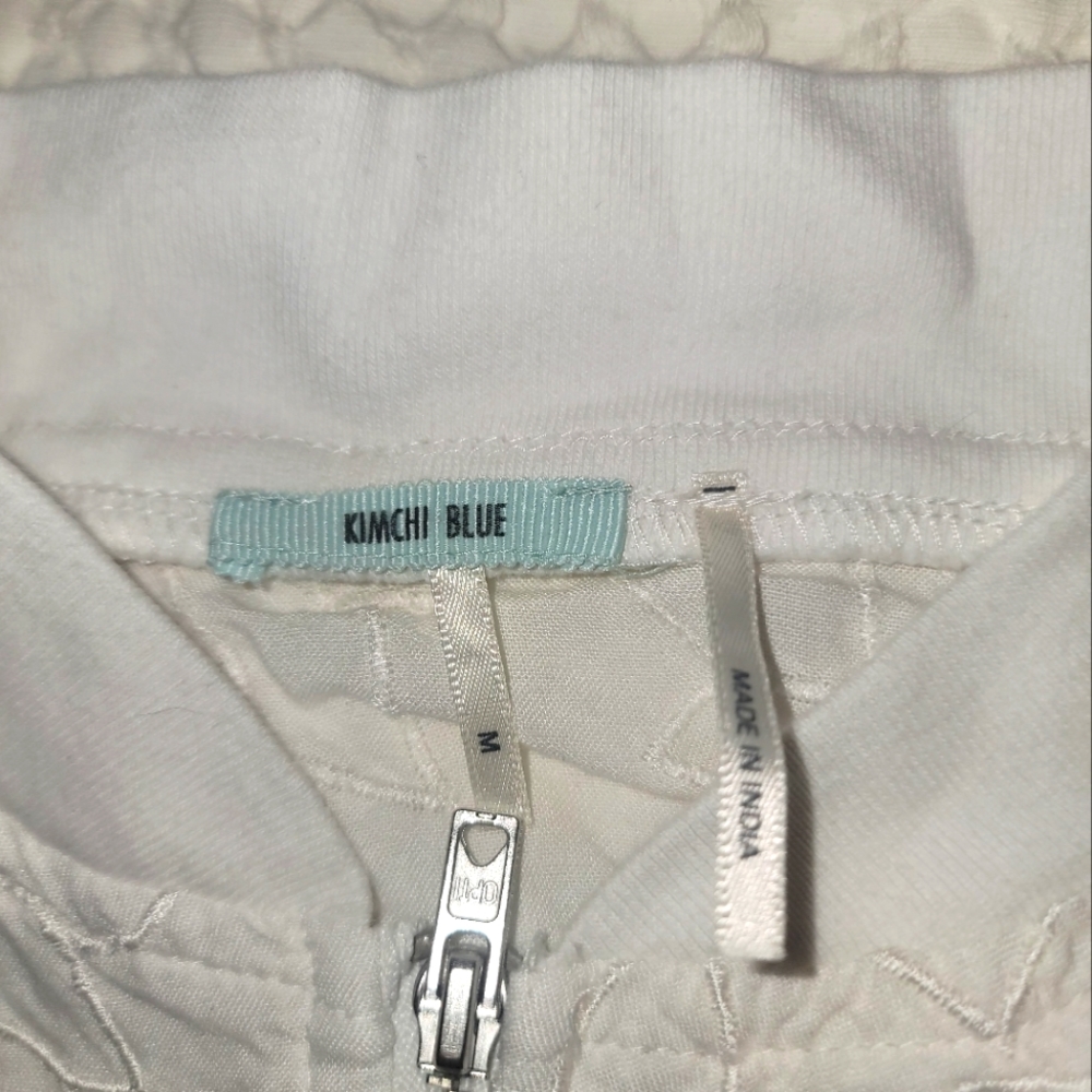 Kimchi Blue White jacket with flowers.